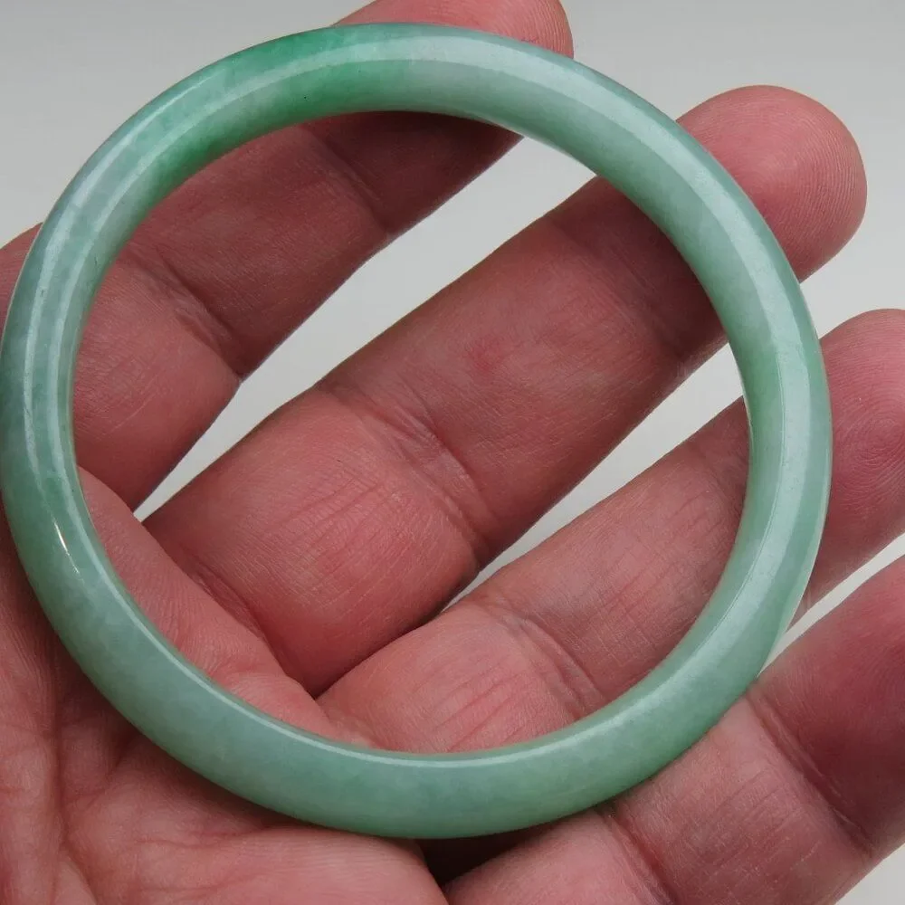 Natural Jade Bangle 2.5 inches=55mm .Other styles and sizes Available in…
